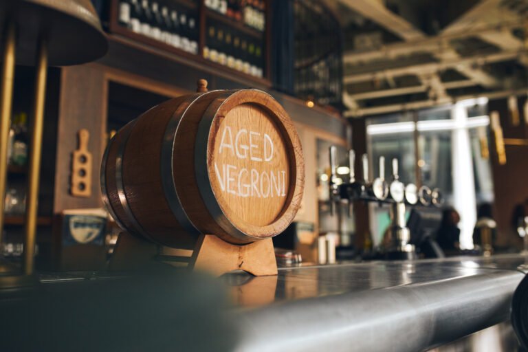 Aged Negroni in cask on bar